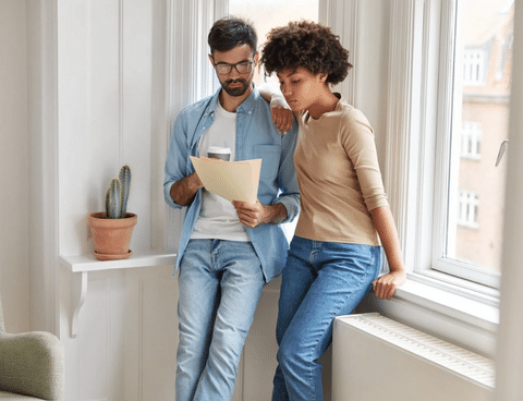 couple reading water bill