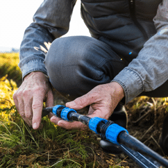 professional plumber repairing the irrigation system